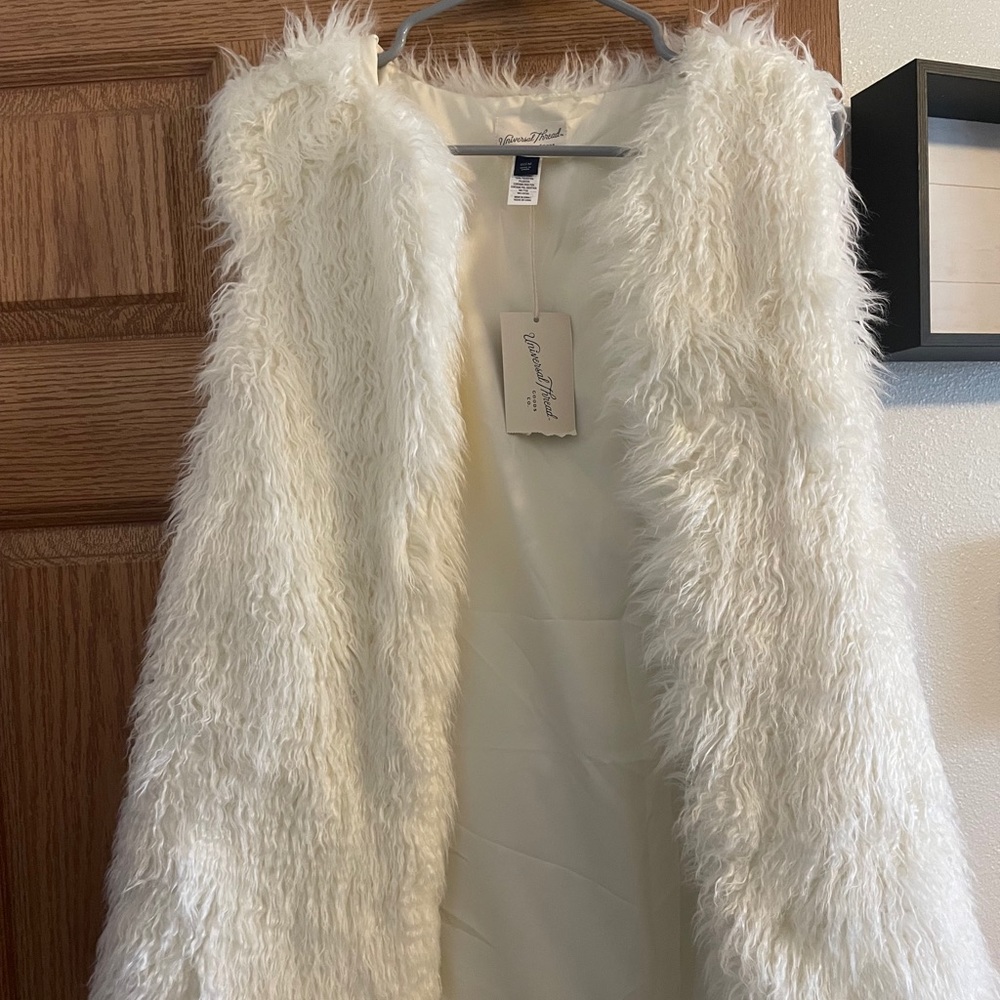 White fur vest